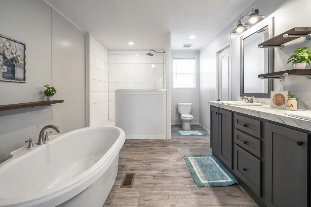 The THE FUSION 32B Primary Bathroom. This Manufactured Mobile Home features 4 bedrooms and 2 baths.