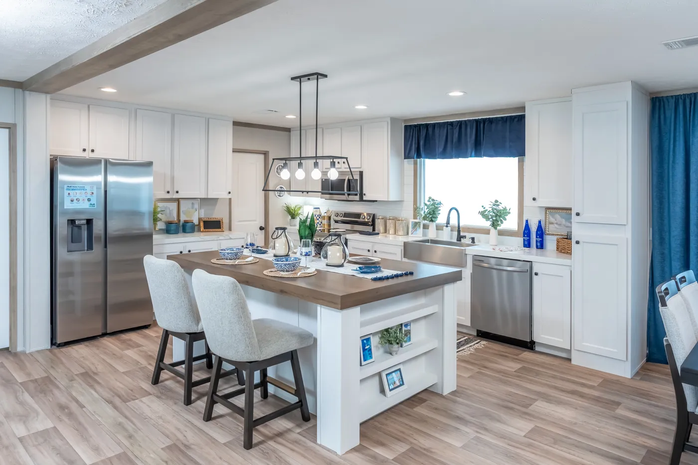 The EL SUENO BREEZE Kitchen. This Manufactured Mobile Home features 4 bedrooms and 2 baths.