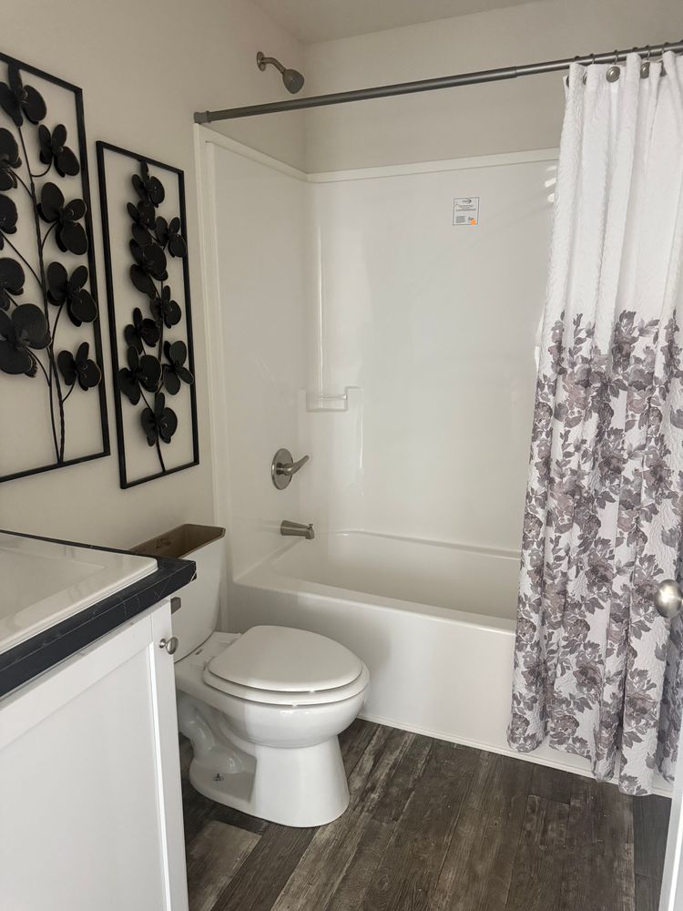 The 7616-SW018 SUNRISE SW Guest Bathroom. This Manufactured Mobile Home features 3 bedrooms and 2 baths.