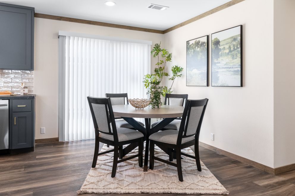 The FARM 4 FLEX Dining Room. This Manufactured Mobile Home features 4 bedrooms and 3 baths.
