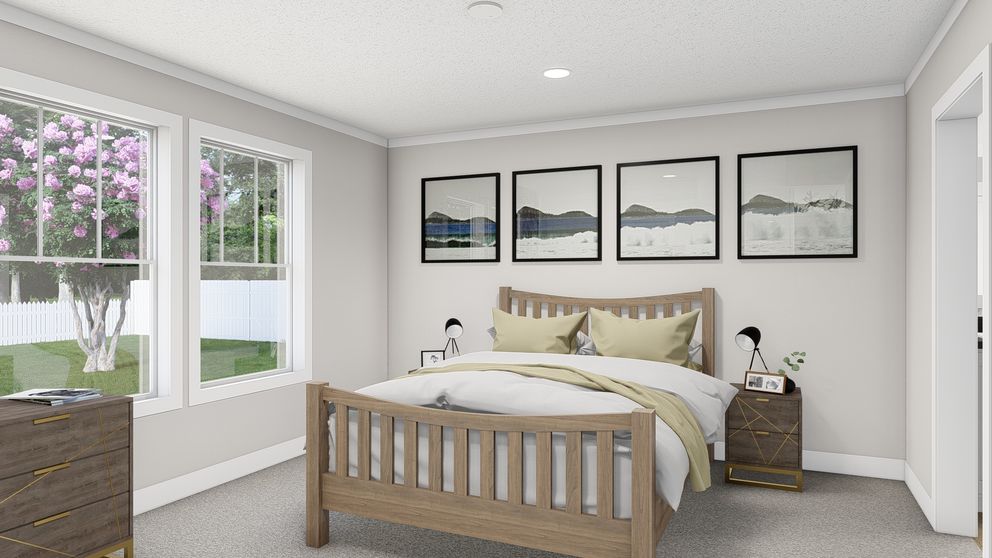The BROWN EYED GIRL Primary Bedroom. This Manufactured Mobile Home features 4 bedrooms and 2 baths.
