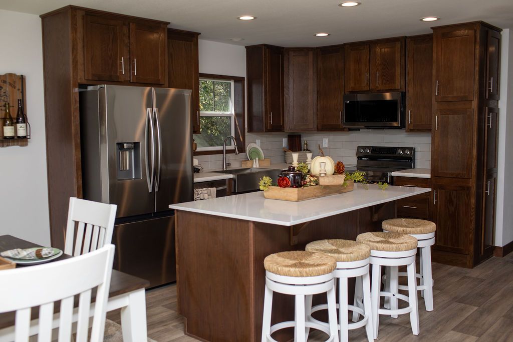 The LEGEND 76-4 Kitchen. This Manufactured Mobile Home features 3 bedrooms and 2 baths.