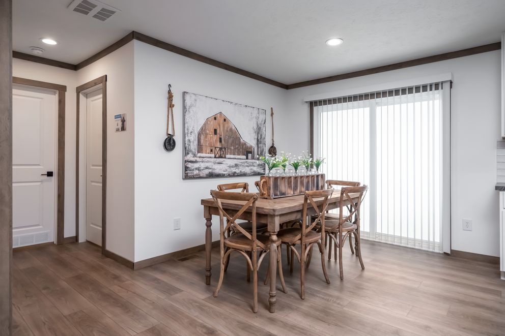 The THE LIZZIE Dining Area. This Manufactured Mobile Home features 3 bedrooms and 2 baths.