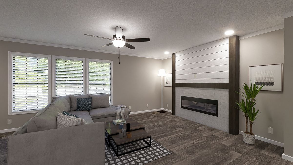 The THE LIL' EASY Living Room. This Manufactured Mobile Home features 3 bedrooms and 2 baths.