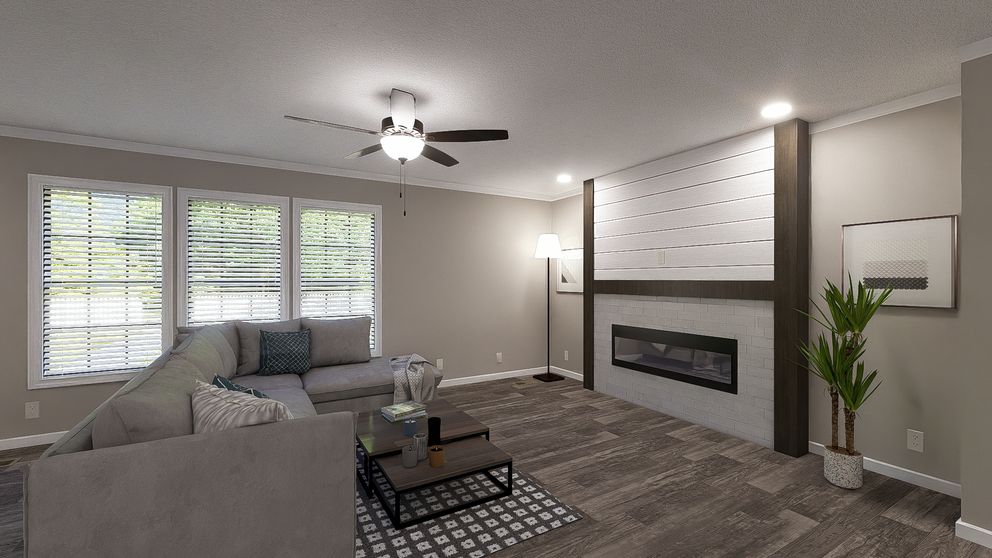 The THE LIL' EASY Living Room. This Manufactured Mobile Home features 3 bedrooms and 2 baths.