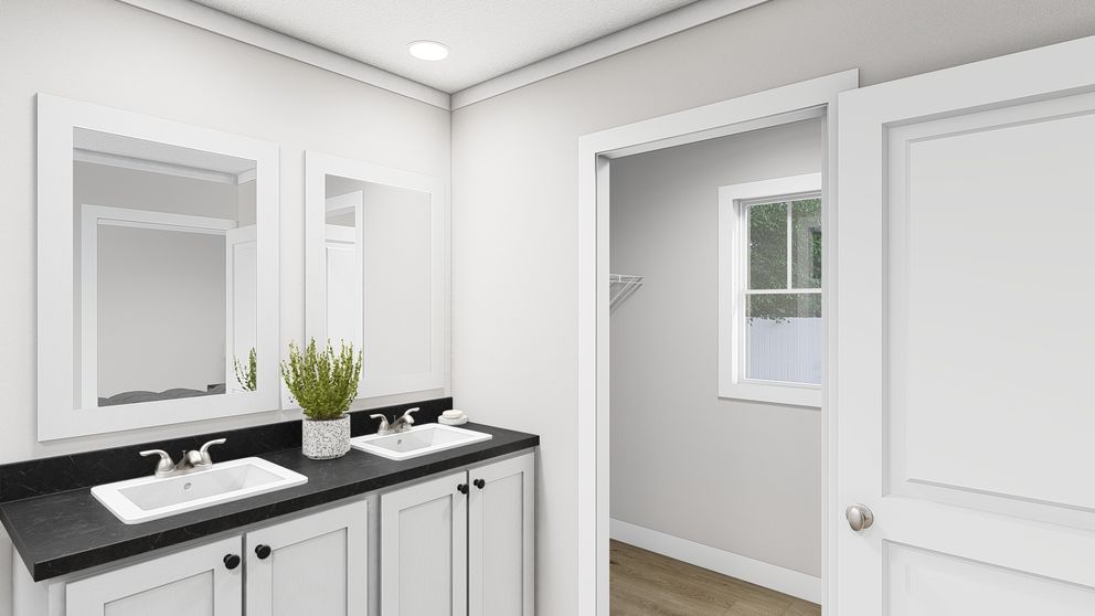 The SWEET CAROLINE Primary Bathroom. This Manufactured Mobile Home features 3 bedrooms and 2 baths.