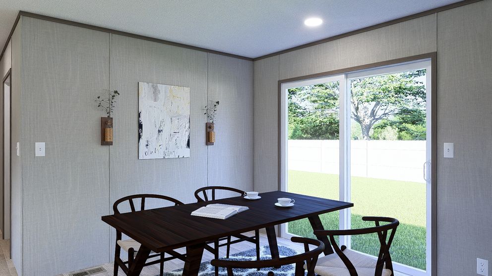 The ULTRA BREEZE 28X76 Dining Area. This Manufactured Mobile Home features 4 bedrooms and 2 baths.