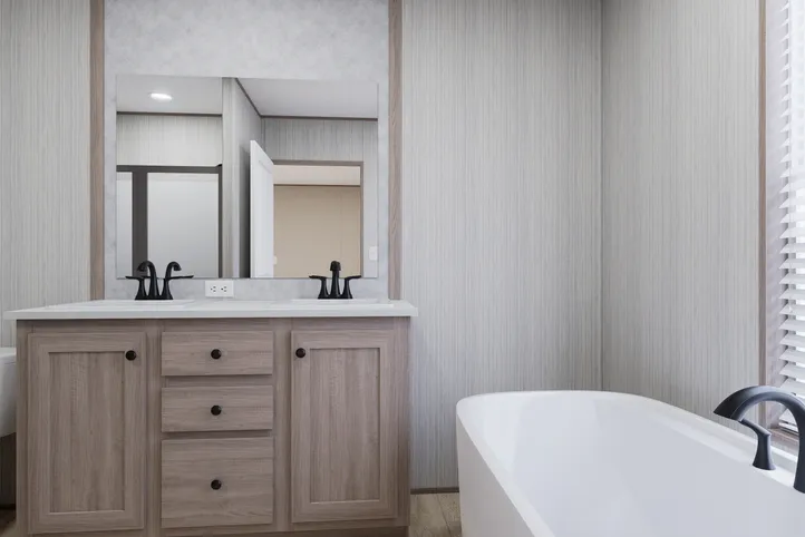 The THE ANNIVERSARY 76 Primary Bathroom. This Manufactured Mobile Home features 3 bedrooms and 2 baths.