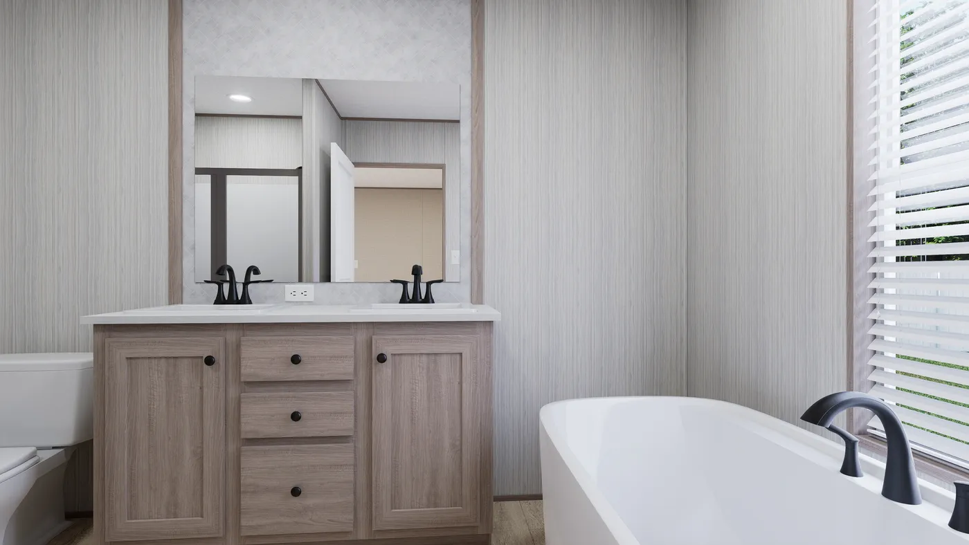 The THE ANNIVERSARY 76 Primary Bathroom. This Manufactured Mobile Home features 3 bedrooms and 2 baths.