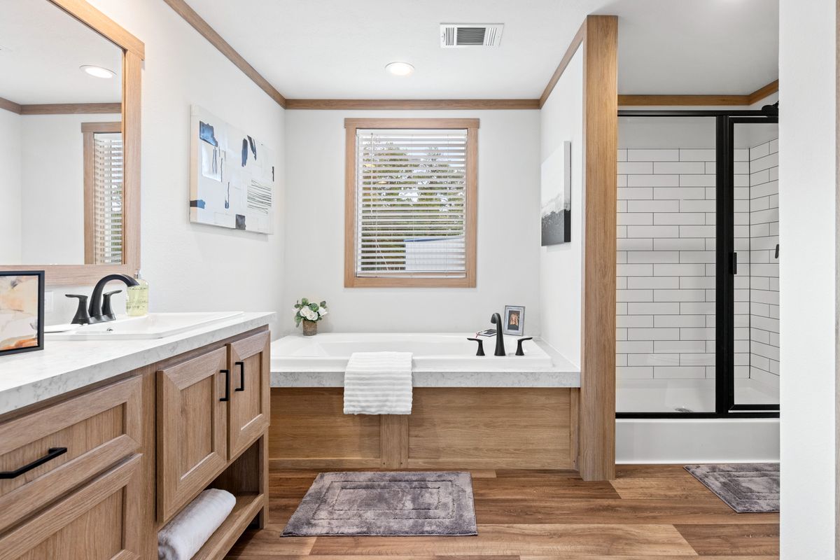 The THATCHER Primary Bathroom. This Manufactured Mobile Home features 4 bedrooms and 2 baths.