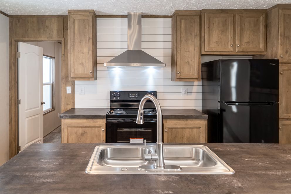 The THE BREEZE Exterior. This Manufactured Mobile Home features 3 bedrooms and 2 baths.