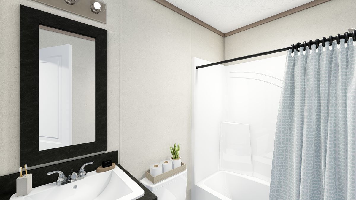 The 7616-4779 THE PULSE Guest Bathroom. This Manufactured Mobile Home features 3 bedrooms and 2 baths.