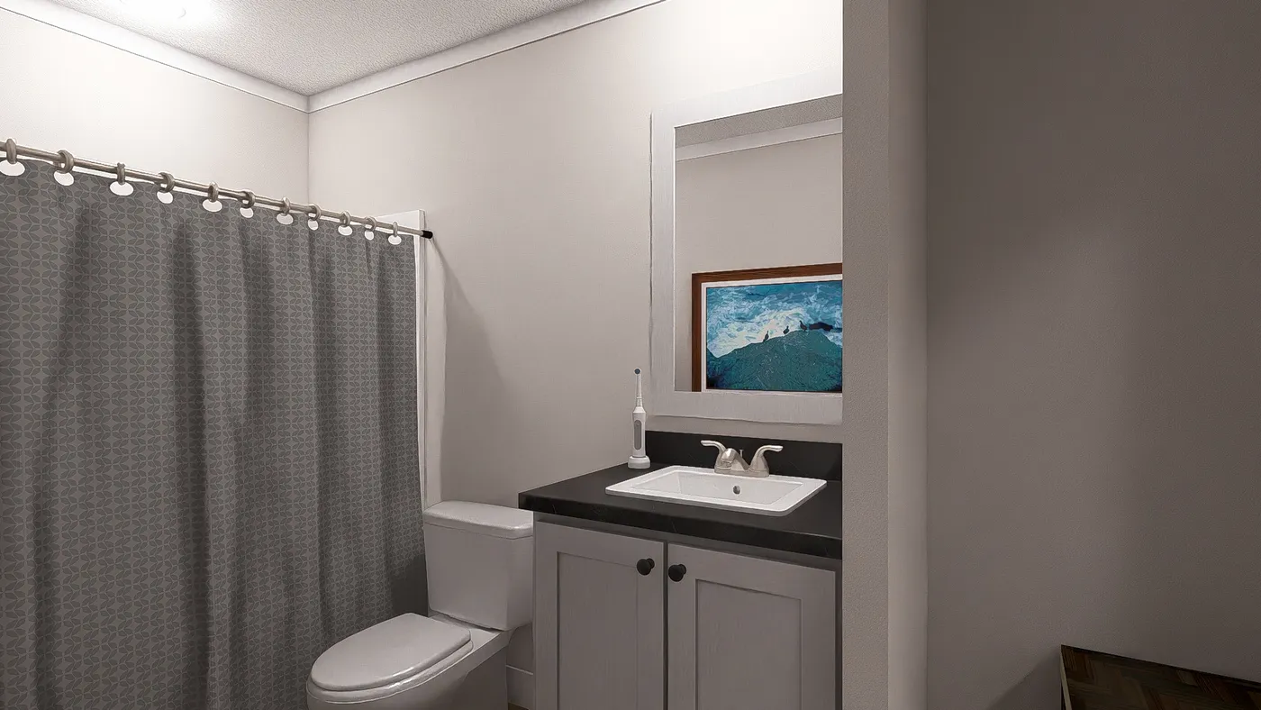The THREE LITTLE BIRDS Guest Bathroom. This Manufactured Mobile Home features 3 bedrooms and 2 baths.