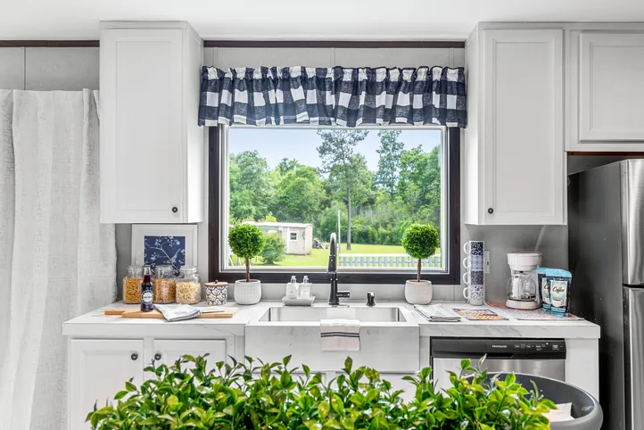 The THE ANNIVERSARY 2.1 Kitchen. This Manufactured Mobile Home features 3 bedrooms and 2 baths.