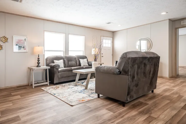 The RIO Living Room. This Manufactured Mobile Home features 3 bedrooms and 2 baths.