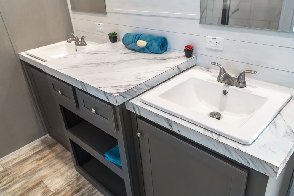 The MAJOR Primary Bathroom. This Manufactured Mobile Home features 3 bedrooms and 2 baths.