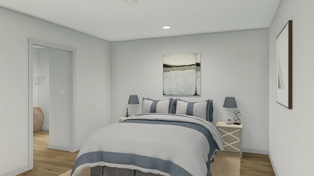 The SOLSBURY HILL 7616 TEMPO Primary Bedroom. This Manufactured Mobile Home features 3 bedrooms and 2 baths.