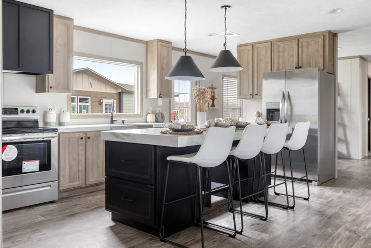 The STERLING XL ANNIVERSARY Kitchen. This Manufactured Mobile Home features 3 bedrooms and 2 baths.