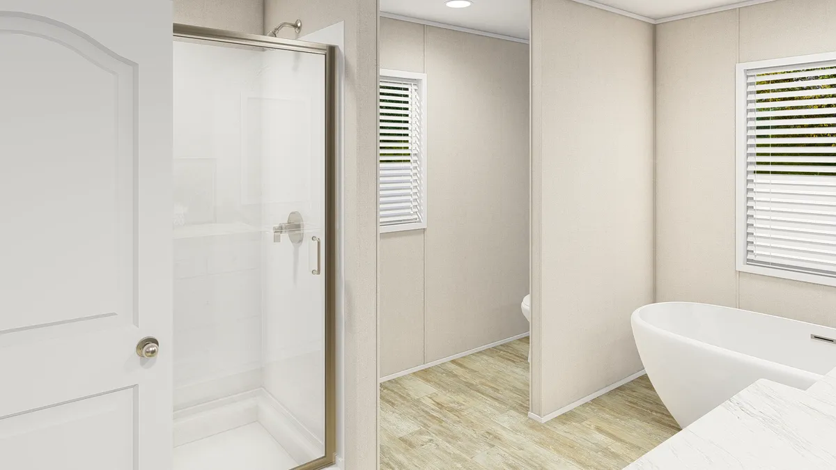 The GRAND LIVING 76 Primary Bathroom. This Manufactured Mobile Home features 4 bedrooms and 2 baths.