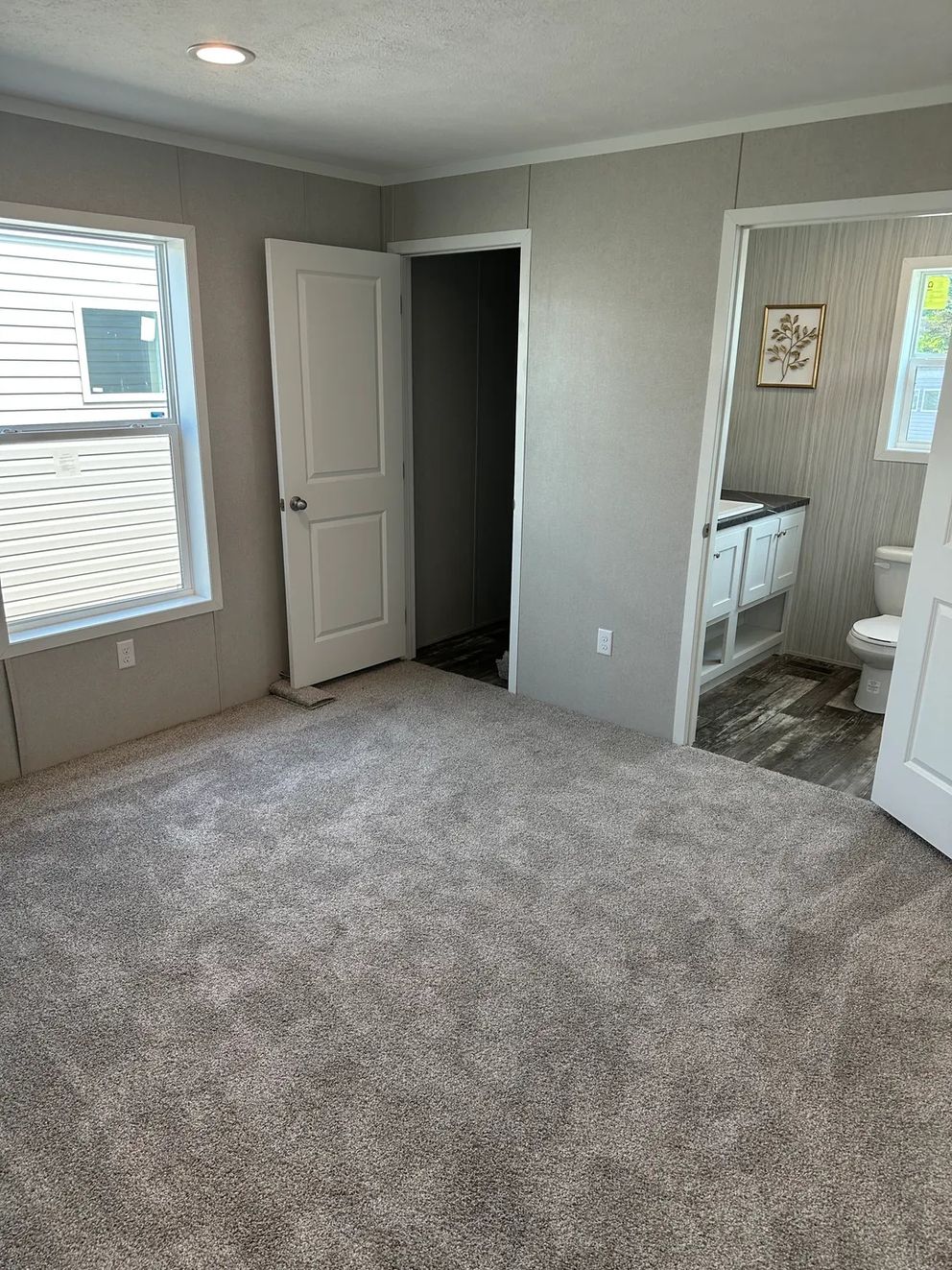 The TOPAZ Primary Bedroom. This Manufactured Mobile Home features 3 bedrooms and 2 baths.