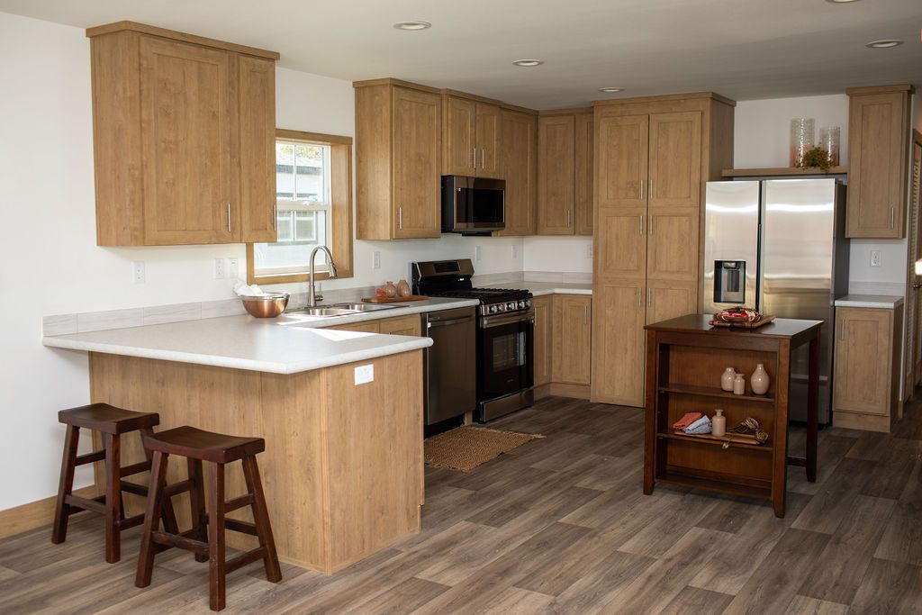 The RAMSEY 223 Kitchen. This Manufactured Mobile Home features 3 bedrooms and 2 baths.