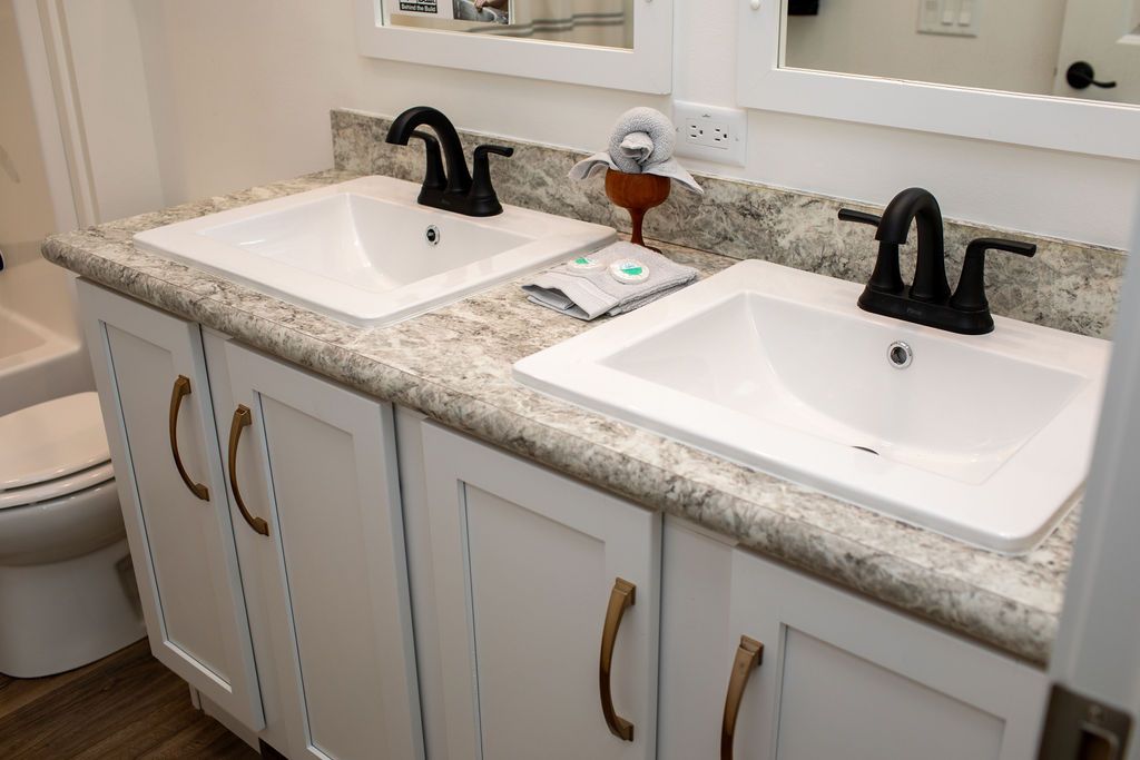 The ENCORE Guest Bathroom. This Manufactured Mobile Home features 3 bedrooms and 2 baths.