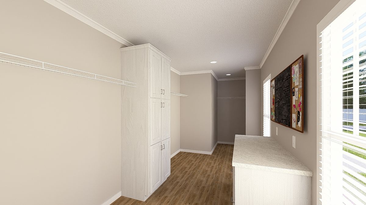 The THE HEXAGON Primary Bedroom Closet. This Manufactured Mobile Home features 4 bedrooms and 3 baths.