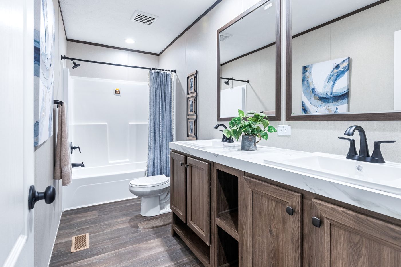The THE RENEGADE Guest Bathroom. This Manufactured Mobile Home features 3 bedrooms and 2 baths.