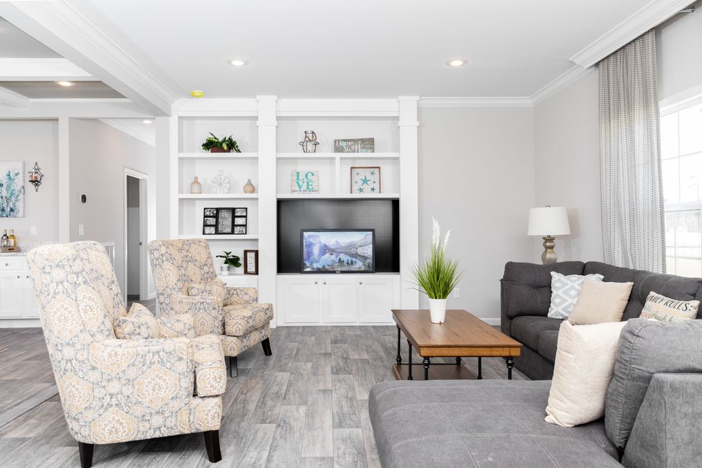 The SUPER 68 ELITE Living Room. This Manufactured Mobile Home features 3 bedrooms and 2 baths.