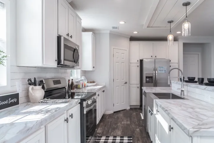 The THE HEWITT Kitchen. This Manufactured Mobile Home features 4 bedrooms and 3 baths.