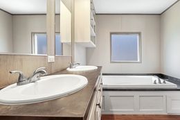 The ANNIVERSARY 16763F Master Bathroom. This Manufactured Mobile Home features 3 bedrooms and 2 baths.