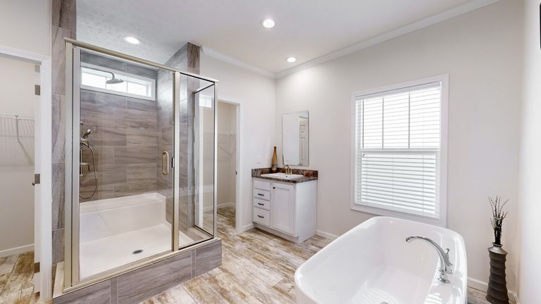 The 4872 ENTERPRISE 32X76 HUD Primary Bathroom. This Manufactured Mobile Home features 4 bedrooms and 2 baths.