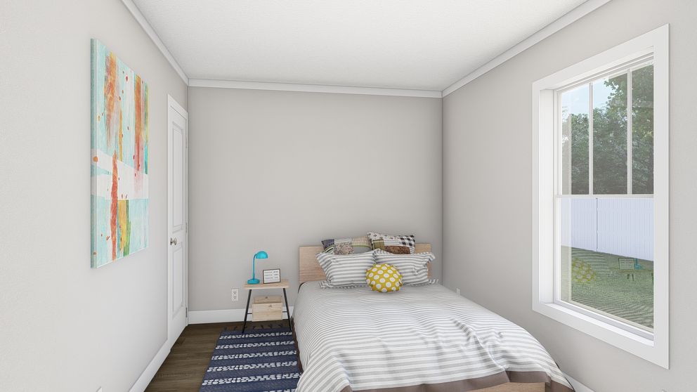 The MOVE ON UP Guest Bedroom. This Manufactured Mobile Home features 3 bedrooms and 2 baths.