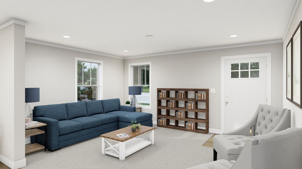 The UNDER PRESSURE Living Room. This Manufactured Mobile Home features 3 bedrooms and 2 baths.