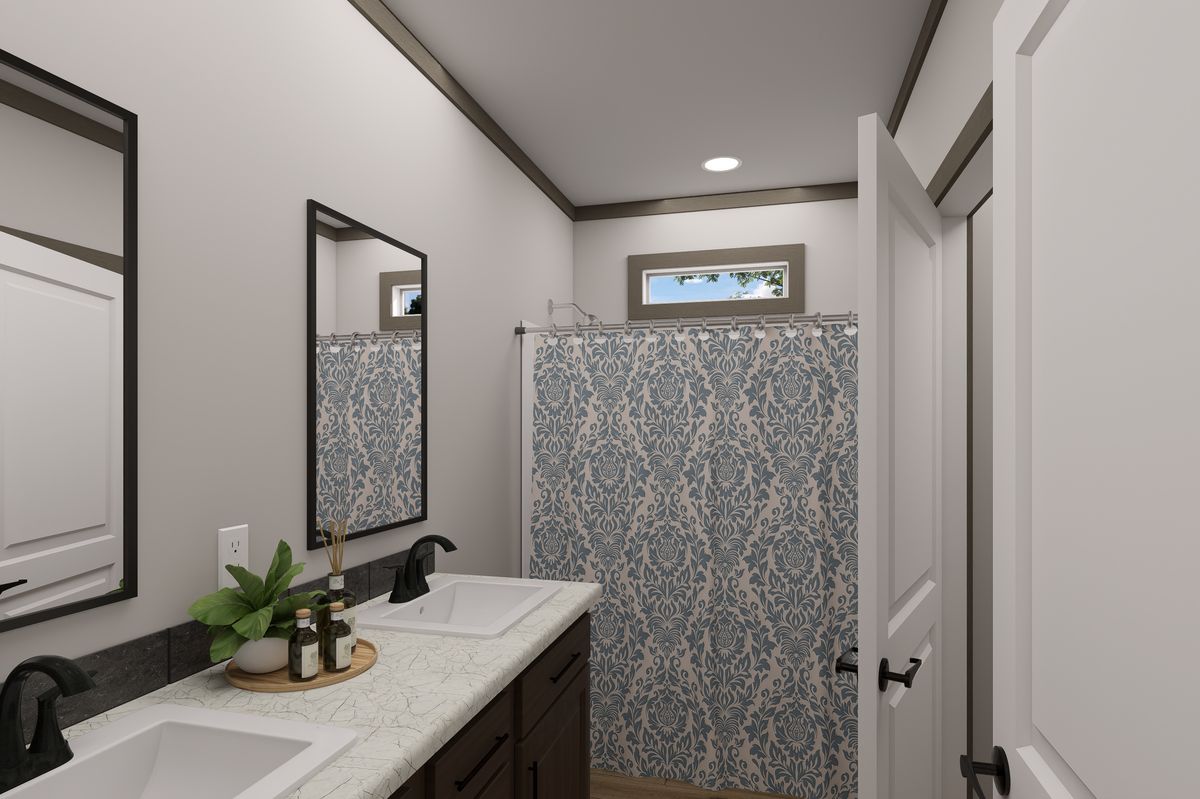 The EASY LIVIN' Guest Bathroom. This Manufactured Mobile Home features 3 bedrooms and 2 baths.