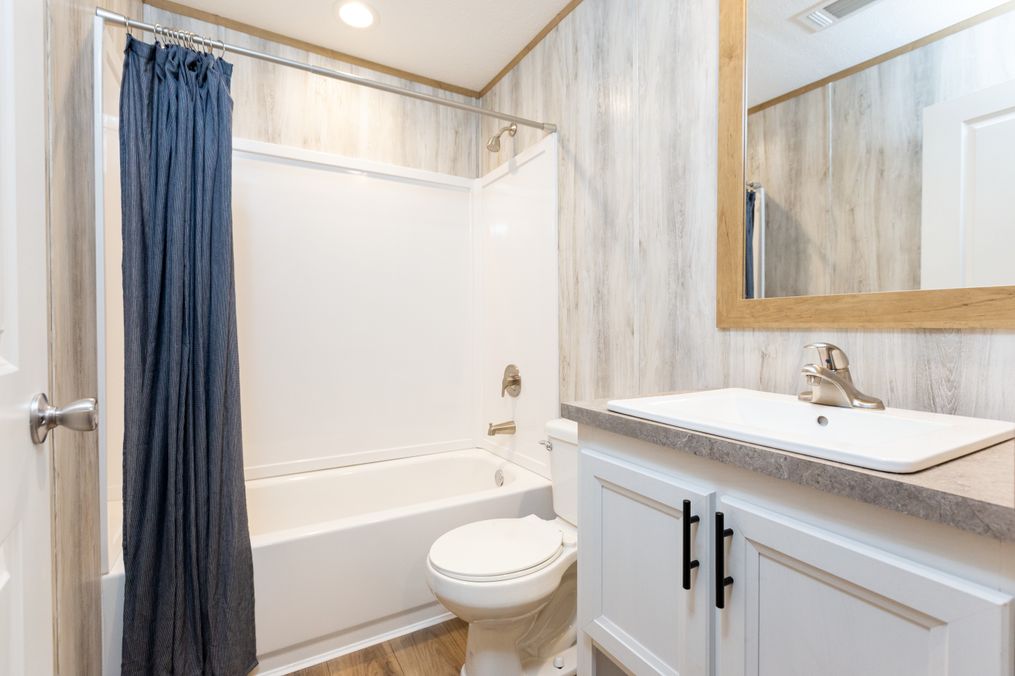 The SYDNEY 8016-1076 Guest Bathroom. This Manufactured Mobile Home features 3 bedrooms and 2 baths.