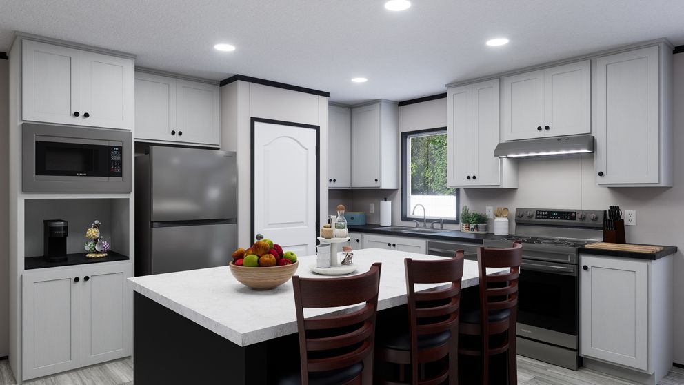 The THE MOUNTAINEER 56 Kitchen. This Manufactured Mobile Home features 3 bedrooms and 2 baths.
