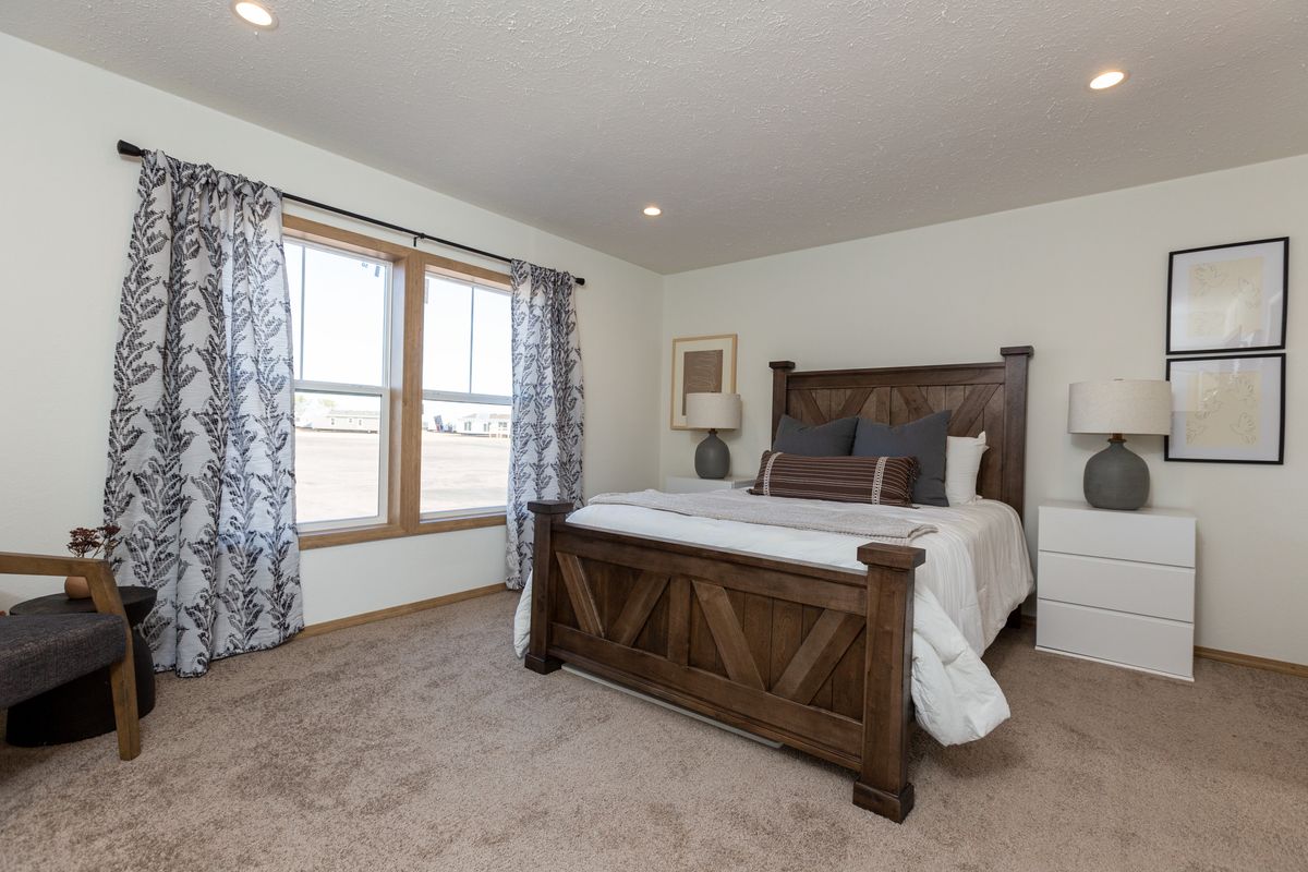 The THE ANTHONY Master Bedroom. This Manufactured Mobile Home features 2 bedrooms and 2 baths.