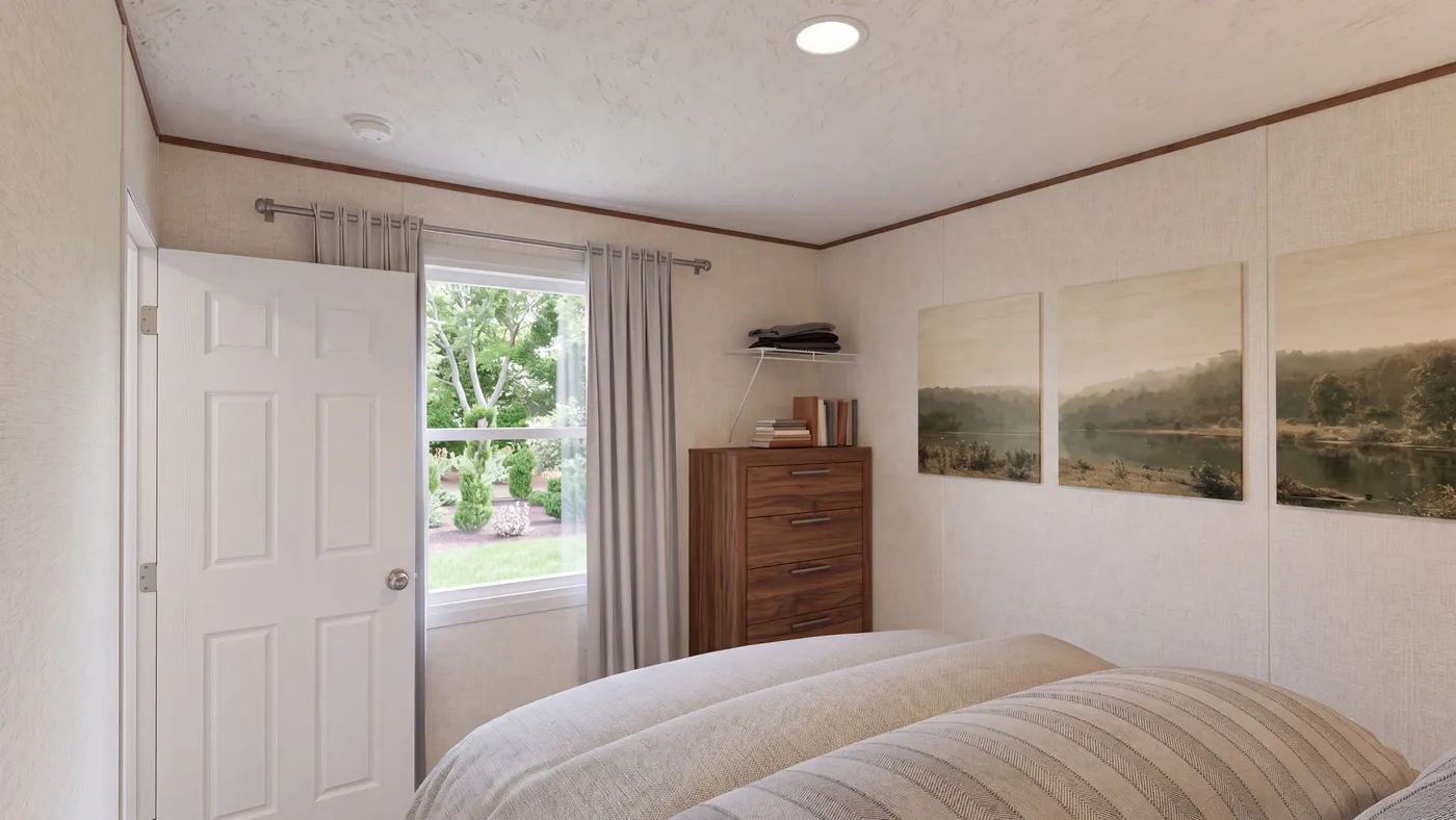 The TULIP Primary Bedroom. This Manufactured Mobile Home features 2 bedrooms and 1 bath.
