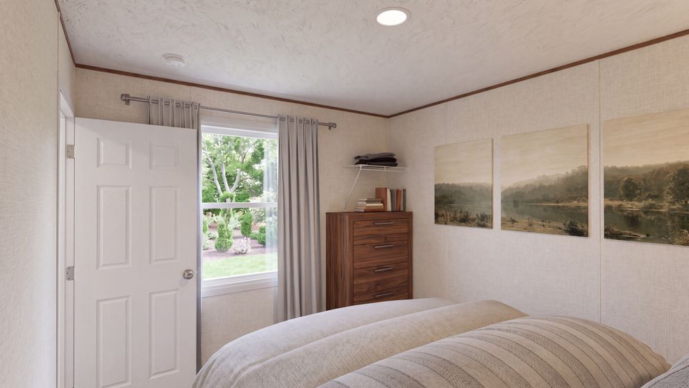The TULIP Primary Bedroom. This Manufactured Mobile Home features 2 bedrooms and 1 bath.