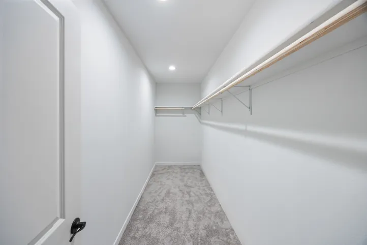 The LULAMAE 3 Primary Bedroom Closet. This Manufactured Mobile Home features 3 bedrooms and 2 baths.