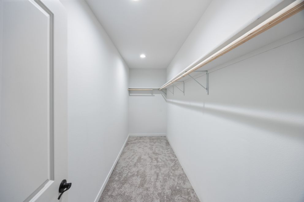 The LULAMAE 3 Primary Bedroom Closet. This Manufactured Mobile Home features 3 bedrooms and 2 baths.