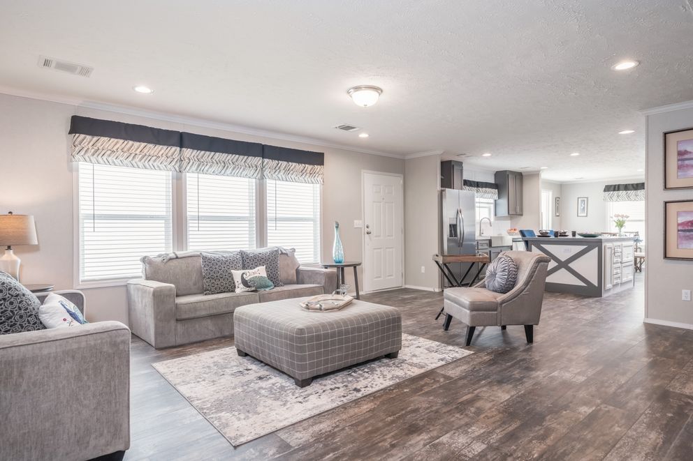 The ALL AMERICAN Living Room. This Manufactured Mobile Home features 3 bedrooms and 2 baths.