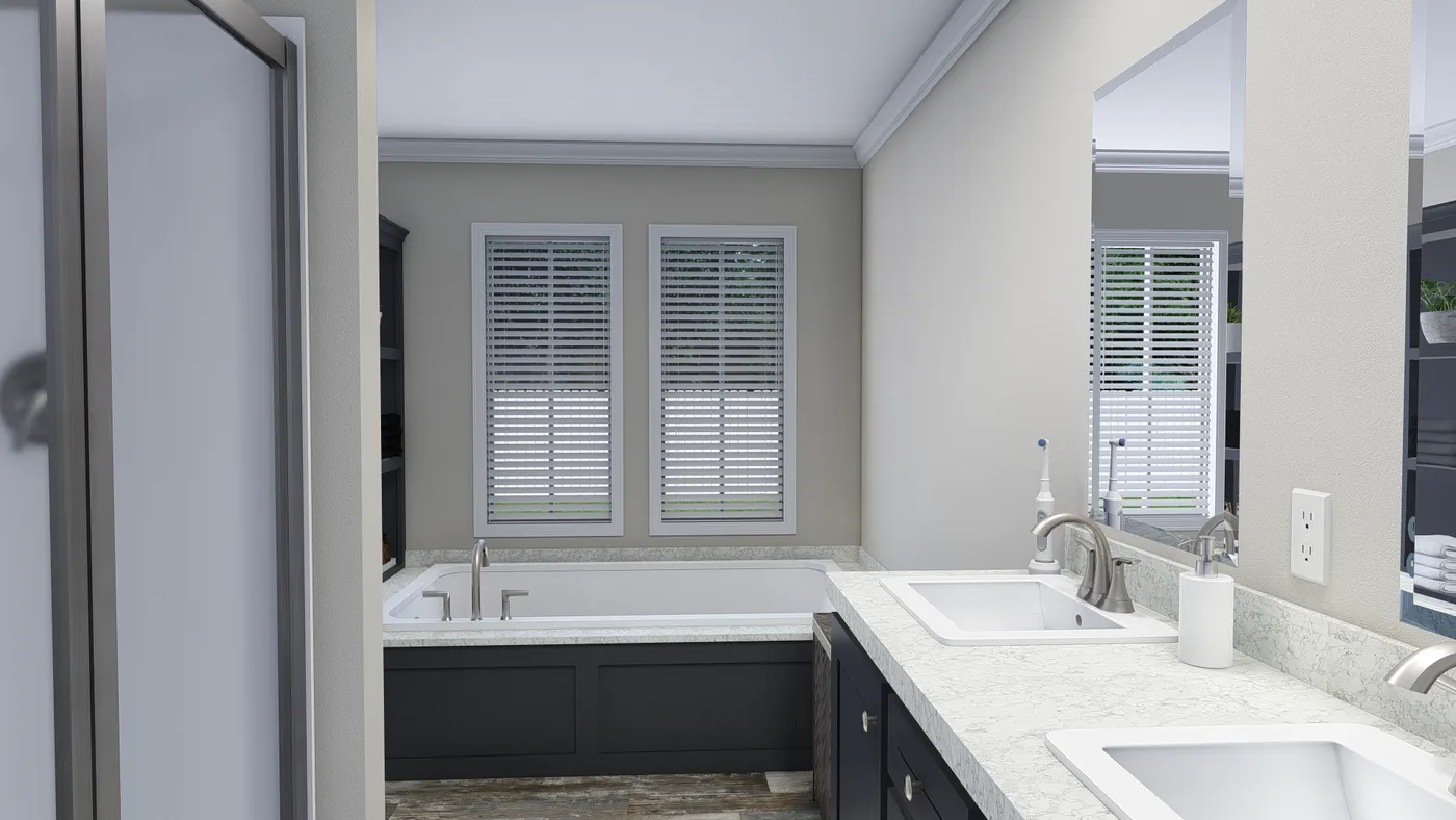 The CAROLINIAN M5000 Primary Bathroom. This Manufactured Mobile Home features 3 bedrooms and 2 baths.