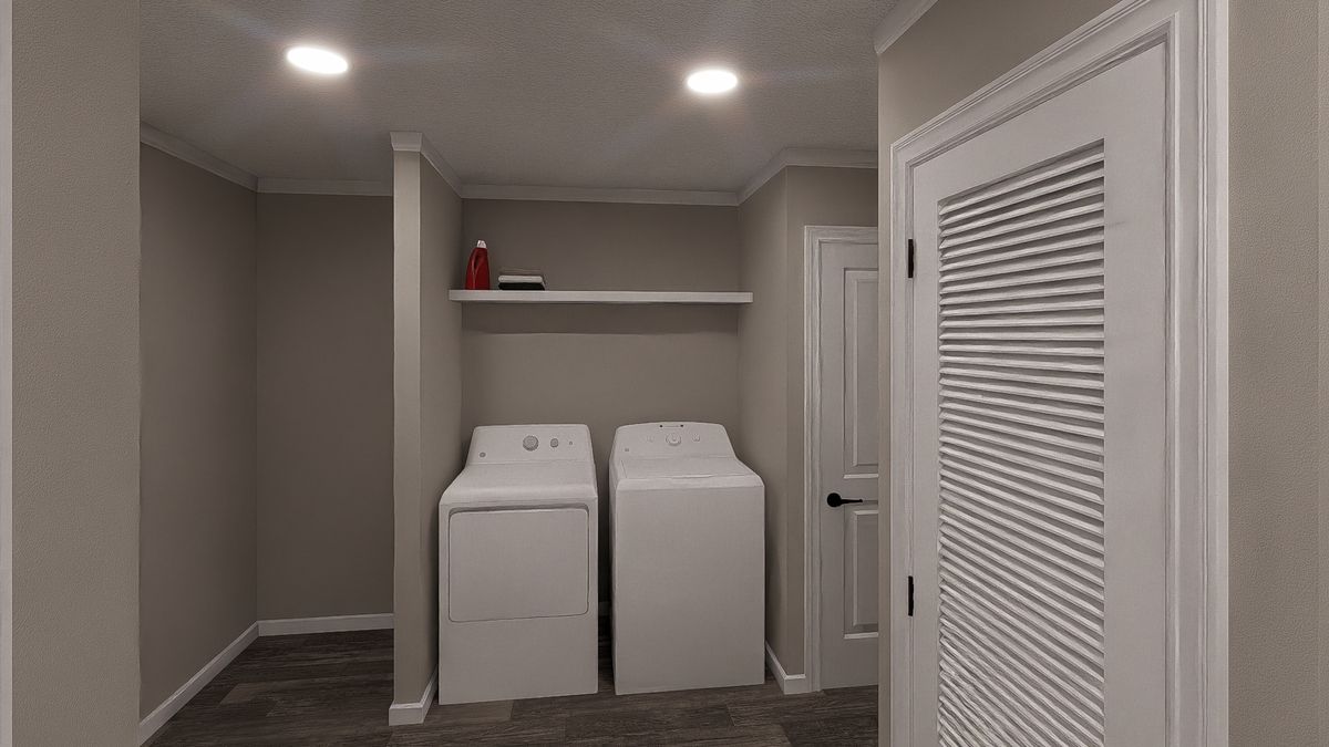 The THE LIL' EASY Utility Room. This Manufactured Mobile Home features 3 bedrooms and 2 baths.