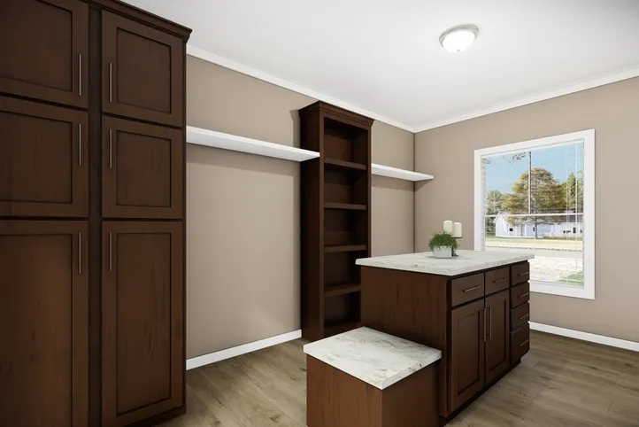 The THE BRYANT Primary Bedroom. This Manufactured Mobile Home features 4 bedrooms and 2 baths.