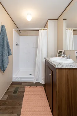 The CELEBRATION Primary Bathroom. This Manufactured Mobile Home features 3 bedrooms and 2 baths.
