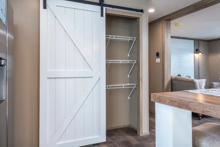 The FARMHOUSE BREEZE 72 Kitchen. This Manufactured Mobile Home features 4 bedrooms and 2 baths.