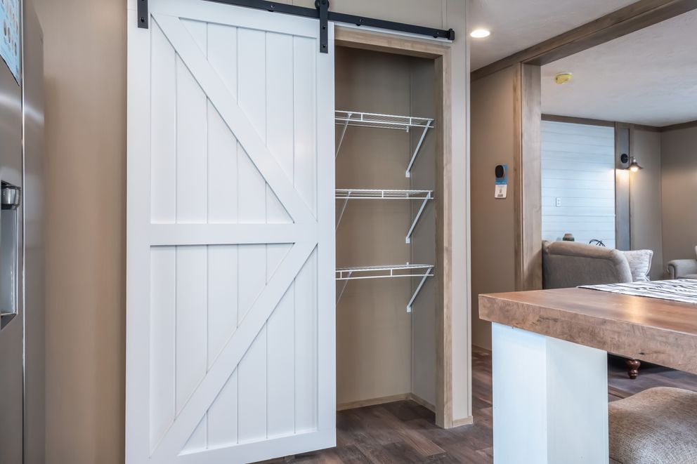 The FARMHOUSE BREEZE 72 Kitchen. This Manufactured Mobile Home features 4 bedrooms and 2 baths.