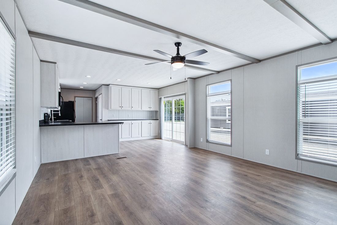 The ANNIVERSARY 16682A Dining Area. This Manufactured Mobile Home features 2 bedrooms and 2 baths.